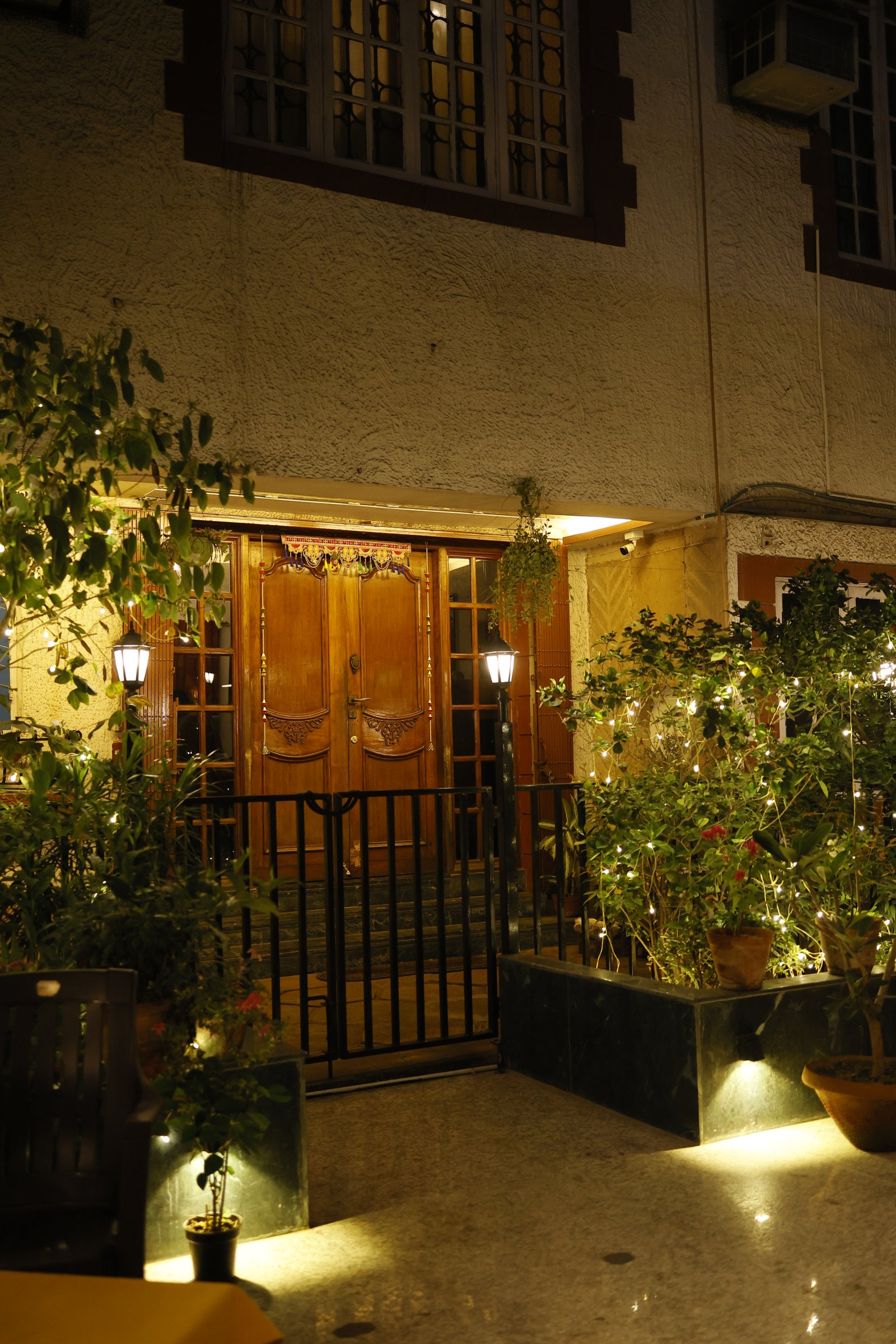 Kalpana — the front entrance lit with fairy lights at night